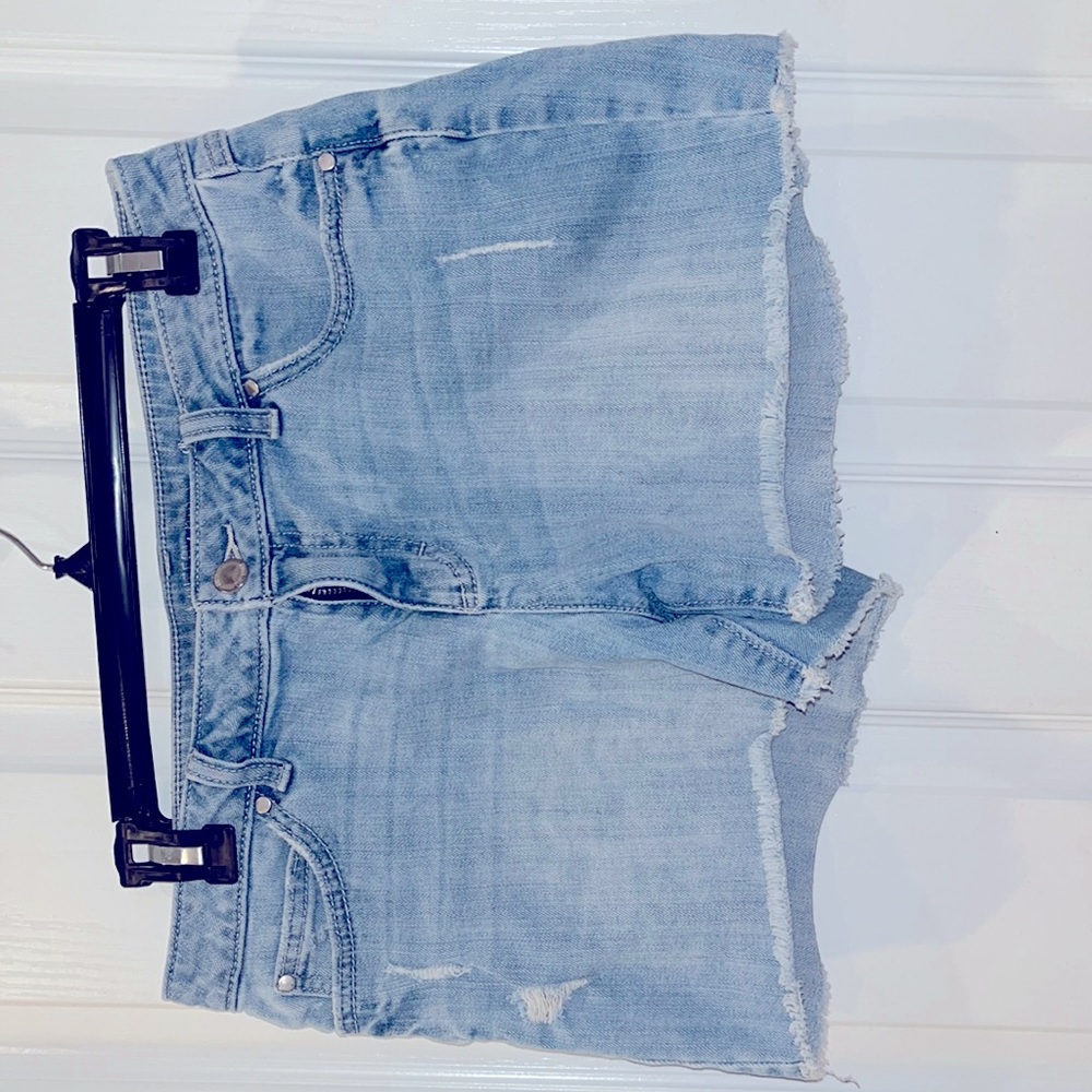 Jennifer Lopez faded denim jean shorts